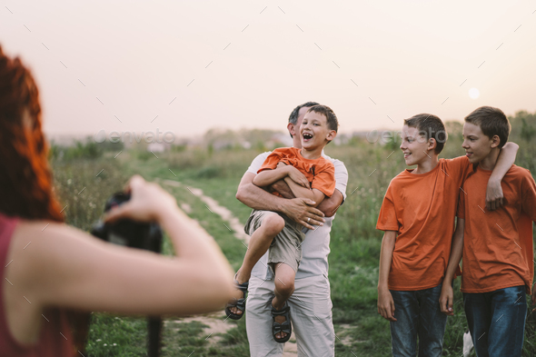 Portrait of a family in nature. - Stock Photo - Images