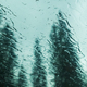 Drops on car glass against mountain forest with thick trees - PhotoDune Item for Sale