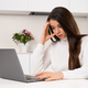 Stressed young woman thinks intensively while working at a computer at home - PhotoDune Item for Sale