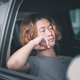 Young asian man with long hair sleeping in his car. - PhotoDune Item for Sale