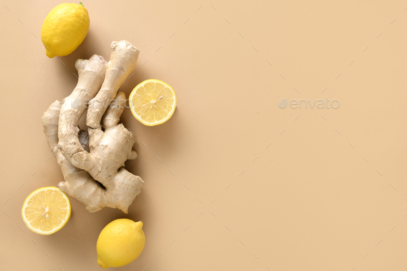 Fresh ginger root and lemon pattern on beige background. Top view. - Stock Photo - Images