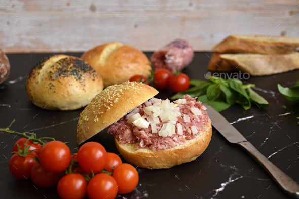 traditional German Zwiebelmett roll on black marble top Stock Photo by ...