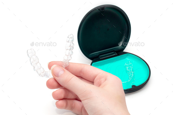 Transparent aligners and storage case. Invisible braces. Clear teeth straighteners.