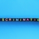 small black cubes with the word Discrimination colored - PhotoDune Item for Sale