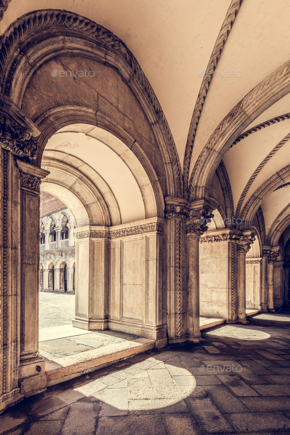 Ancient columns with arches at Palazzo Ducale or Doge's Palace in Venice, Italy - Stock Photo - Images