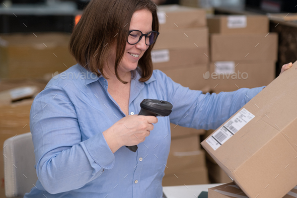 female scanning barcode on box quality control for online sales, SME online shop e-commerce concept