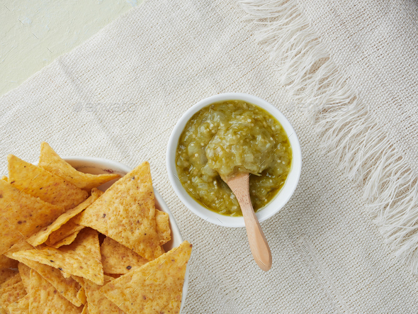 tortilla chips and mexican green tomatoes sauce.