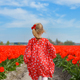 Girl running in a red tulip field - PhotoDune Item for Sale