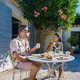 couple having breakfast in a garden at a luxury vacation in the Provence France, - PhotoDune Item for Sale