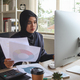 muslim business woman behind paper work, tired and frustrated. Working in office - PhotoDune Item for Sale