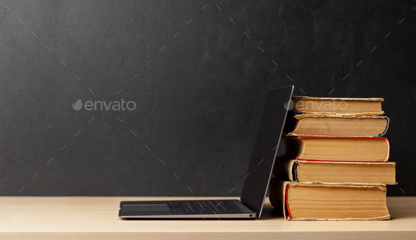 Laptop and stack of notepads - Stock Photo - Images