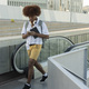 young african guy with smart phone going up escalator - student on campus - - PhotoDune Item for Sale