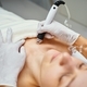 A cosmetologist performs hydropiling in a beauty salon. Skin care. - PhotoDune Item for Sale