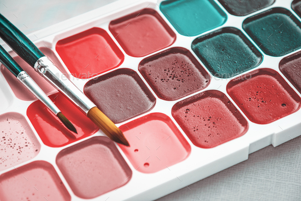 Closeup Of Watercolor Paintbox And Paint Brush Stock Photo