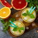 Grapefruit and orange gin cocktail or margarita, refreshing drink with ice. Top view flat lay. - PhotoDune Item for Sale