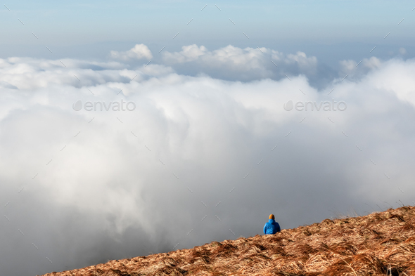 Alone tourist on the edge of the cliff - Stock Photo - Images