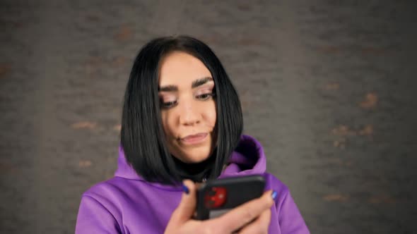 Frustated Young Brunette Woman Feeling Upset Using Smartphone's Face Unlock Feature Wearing Face alt