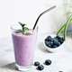 Blueberry smoothie in a glass on the table. Ideal for vegetarian breakfast, diets and detox - PhotoDune Item for Sale