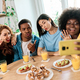 Happy multiethnic friends talking a selfie at home - PhotoDune Item for Sale