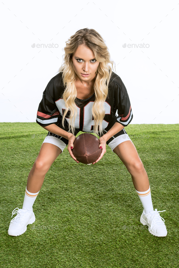 Woman Wearing Football Top Holding American Football Stock Photo