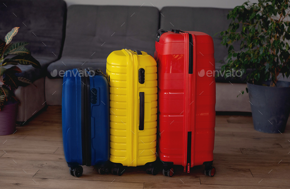 suitcases packed for summer journey in room. travel concept - Stock Photo - Images