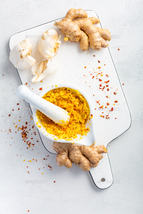 Homemade Fresh Ginger and Garlic paste or Adrak Lahsun puree in ceramic bowl - Stock Photo - Images