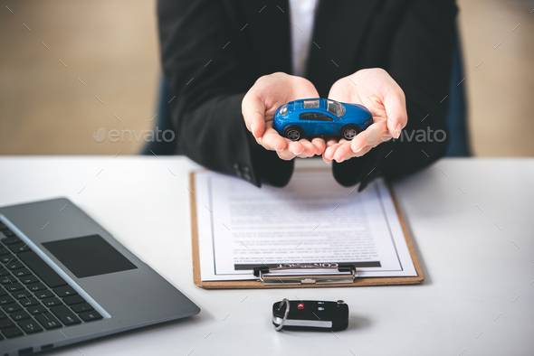 Employees sell keys to customers after agreeing to buy and sell cars. Approve auto loan contracts to