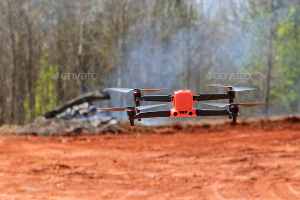 A construction site drone is being controlled by an experienced engineer architect - Stock Photo - Images