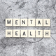 Mental Health word tiles on a cracked concrete background - PhotoDune Item for Sale