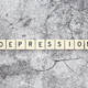 Depression word tiles on a cracked concrete background - PhotoDune Item for Sale