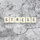 Stress word tiles on a cracked concrete background - PhotoDune Item for Sale