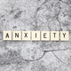 Anxiety word tiles on a cracked concrete background - PhotoDune Item for Sale