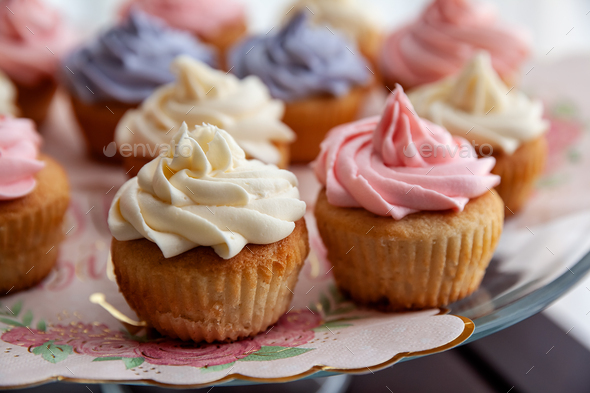 Closeup of colorful cupcakes for Birthday party, ready to eat homemade mini cakes - Stock Photo - Images