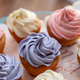 Top view of colorful cupcakes freshly made for Birthday party in a selective focus - PhotoDune Item for Sale