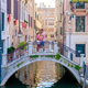 couple men and women on a city trip in Venice Italy sitting at a bridge above the canals of Venice - PhotoDune Item for Sale