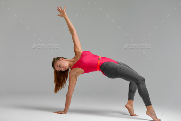 Lifestyle Portrait of Fitness Pretty Young Woman Wearing Grey
