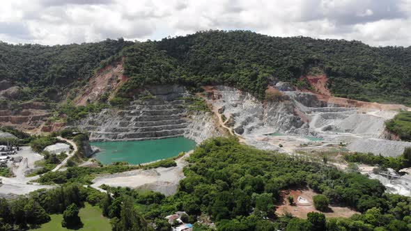 Aerial view of opencast mining quarry with big pool. Aerial view from drone shoot alt