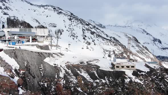 Ski Resort with Poma Lift on Snowy Mountain Slope in Winter alt