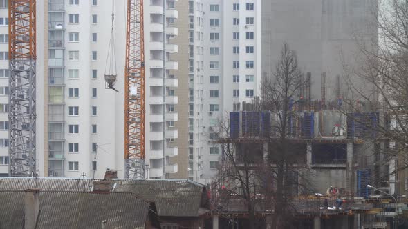 Construction Cranes Working Autumn Rainy Morning alt
