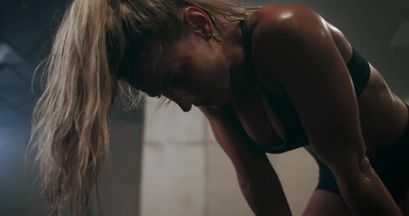 Tired Woman Breathing Heavily After a Workout, Sweat Dripping Demolition Slow Motion alt