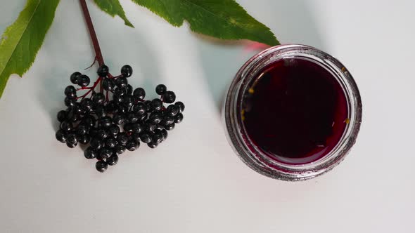 Freshly Squeezed Juice Of Elderberry, Black Elderberry On A White Background, Medicinal Herbal