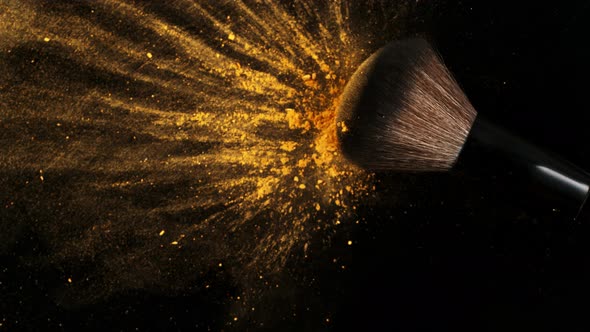 Super Slow Motion Shot of Makeup Brush and Brown Powder Falling on Black Table at 1000 Fps alt