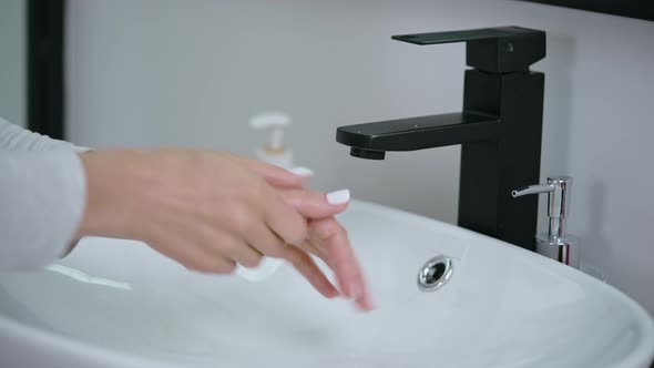 Woman Wash Hands with Soft Soap