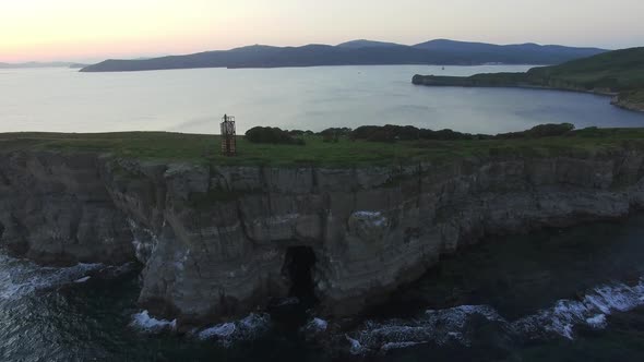 Drone View of a Beautiful Peninsula Tobizina with Vertical Cliffs at Sunset alt