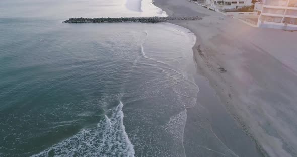 Aerial View of the Waves Crashing Along the Coast Wave Breaker in Palavas