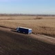 Semi Truck with Cargo Trailer Attached Moving Through Corn Field Background - VideoHive Item for Sale