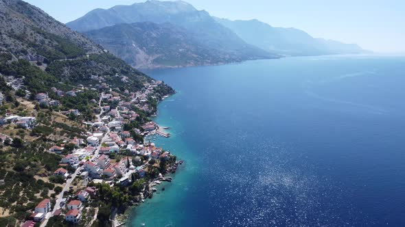 drone flies to the beautiful fishing village of pisak on the Adriatic, cinematic shot (dalmatia, cro alt