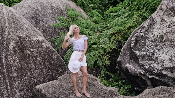 Beautiful Woman in Picturesque Tropical Landscape alt