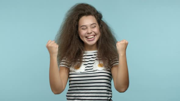 Slow Motion of Pretty Girl Winning Prize and Celebrating Shouting Yes Wth Joy and Fist Pump alt