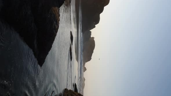 Vertical shot of tide pools on Bandon Beach in Oregon. alt